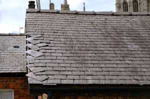 Loose slates on roof of a house - emergency roofing